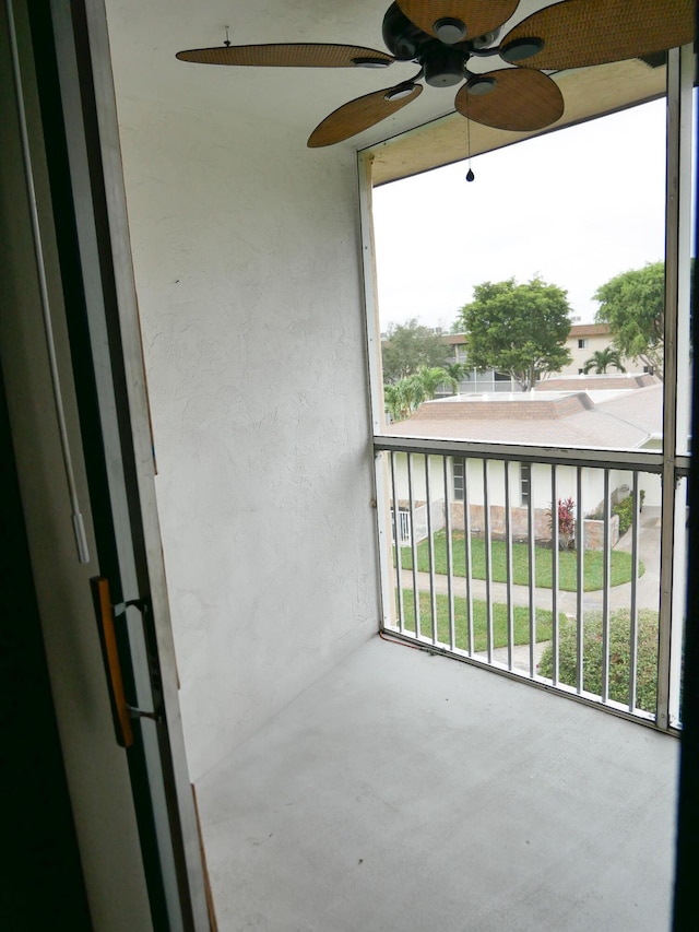 balcony with covered porch and ceiling fan