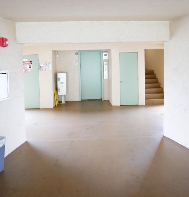 unfurnished room featuring concrete flooring