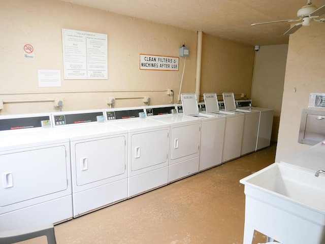 washroom featuring ceiling fan, sink, and washer and dryer