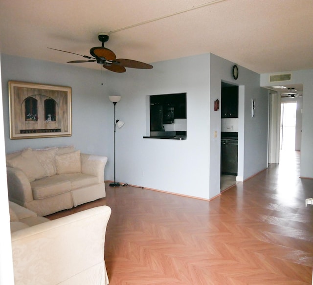 unfurnished living room featuring light parquet flooring and ceiling fan