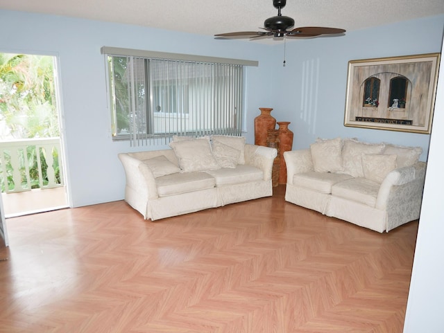 living room featuring ceiling fan and light parquet floors