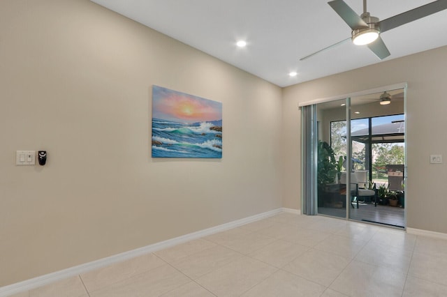 empty room featuring ceiling fan and light tile patterned floors