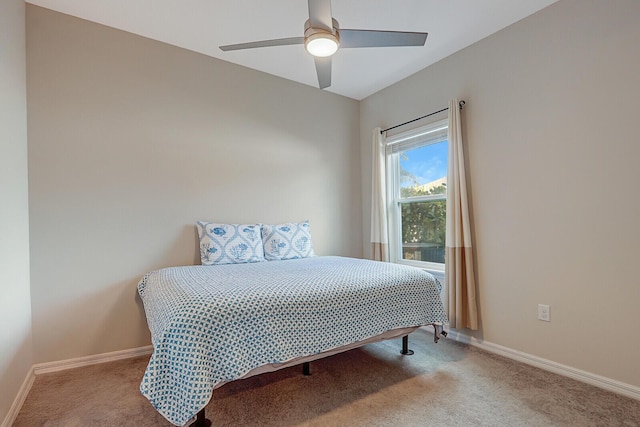 bedroom featuring ceiling fan and light colored carpet