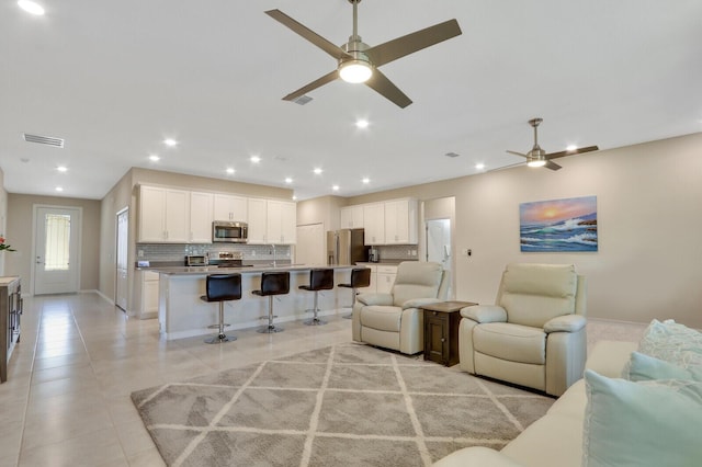 living room featuring ceiling fan