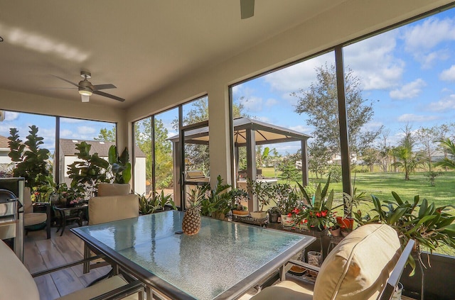 sunroom / solarium with ceiling fan