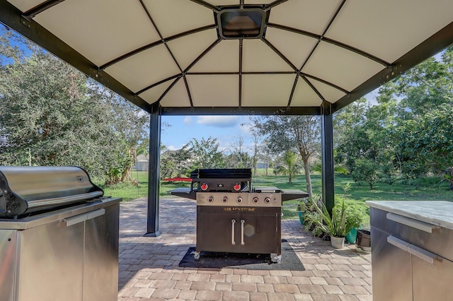 view of patio / terrace featuring a gazebo and grilling area