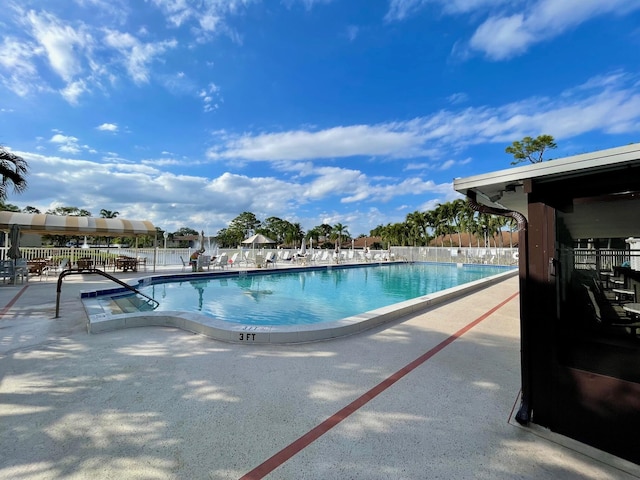 view of swimming pool featuring a patio area