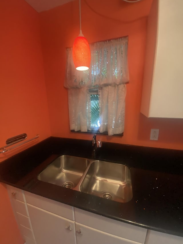 kitchen with white cabinets and sink