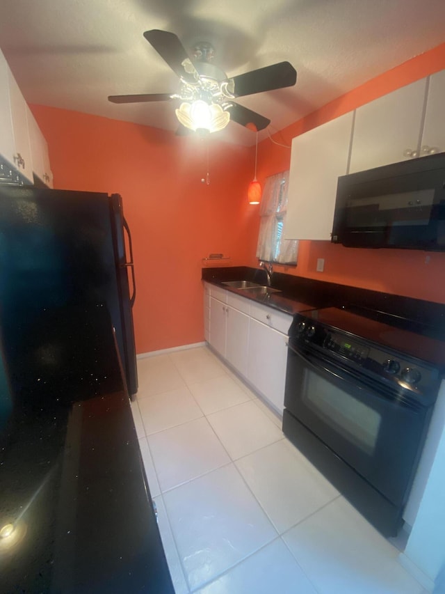 kitchen featuring ceiling fan, sink, white cabinets, light tile patterned flooring, and black appliances