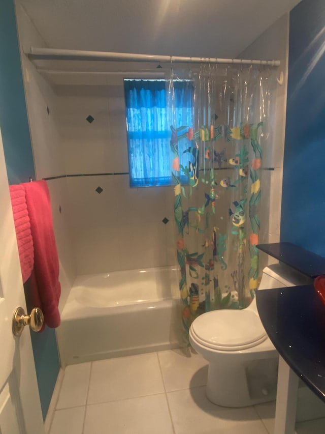 bathroom with tile patterned flooring, toilet, and shower / bath combo with shower curtain