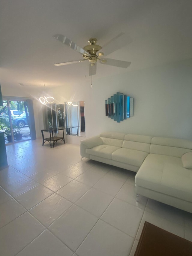 tiled living room featuring ceiling fan