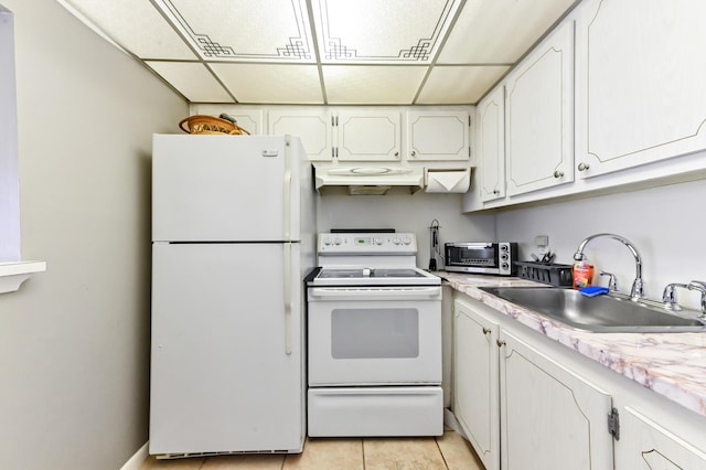 kitchen with a toaster, light tile patterned flooring, white cabinetry, a sink, and white appliances