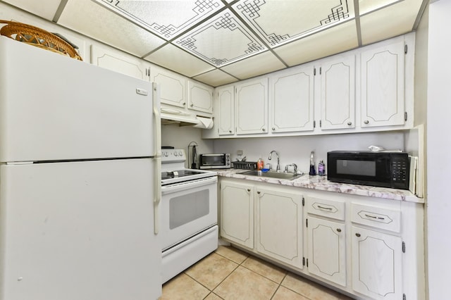 kitchen featuring light countertops, light tile patterned flooring, a sink, white appliances, and under cabinet range hood