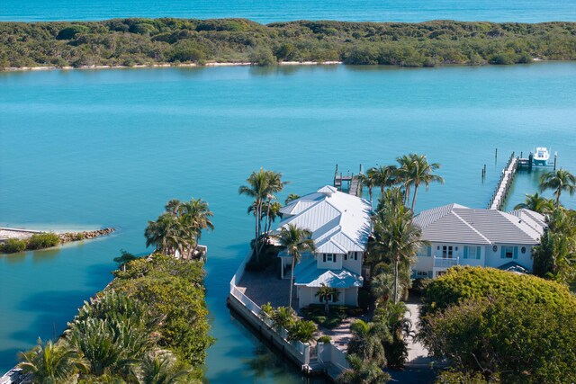 rear view of property with a water view and a patio