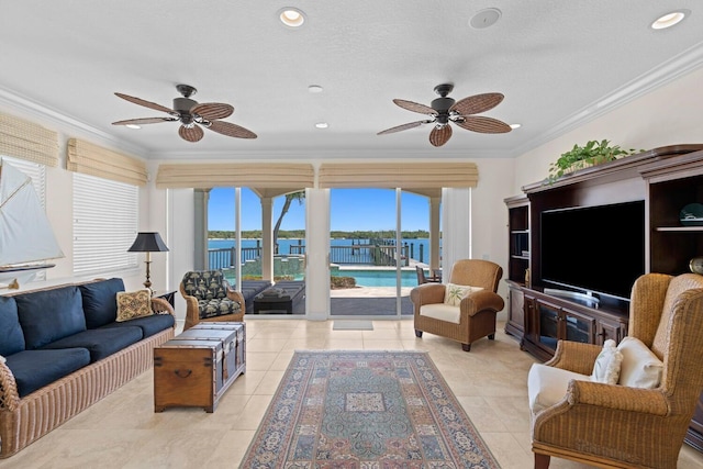 living room featuring crown molding, light tile patterned floors, a textured ceiling, and ceiling fan