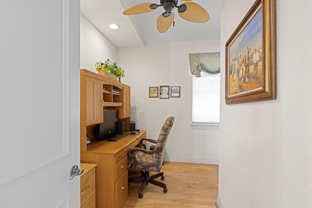 home office featuring light hardwood / wood-style floors and ceiling fan