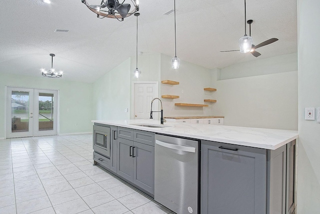 kitchen featuring gray cabinetry, light stone countertops, ceiling fan with notable chandelier, and appliances with stainless steel finishes