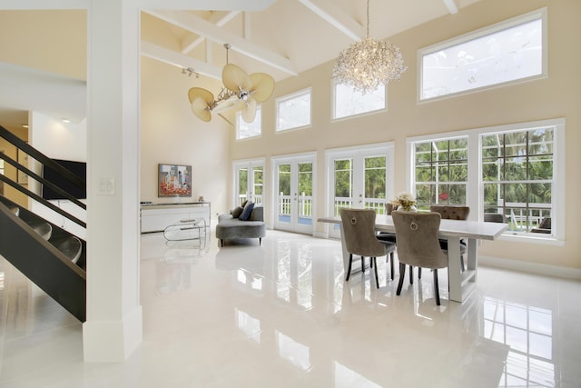 tiled dining room with stairway, french doors, a high ceiling, and a chandelier