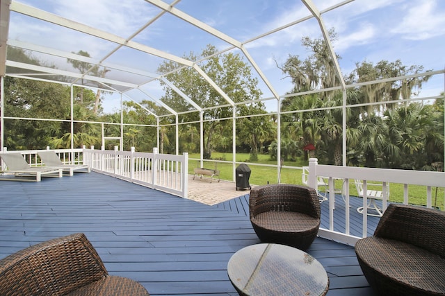 wooden deck with a lanai