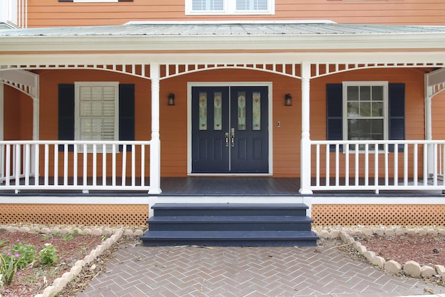 entrance to property with a porch