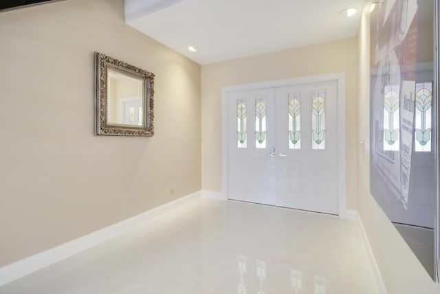 entrance foyer with recessed lighting and baseboards