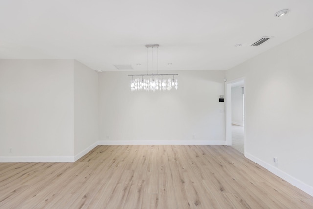 unfurnished room with light hardwood / wood-style flooring