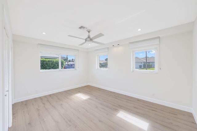 empty room featuring light wood-type flooring and ceiling fan