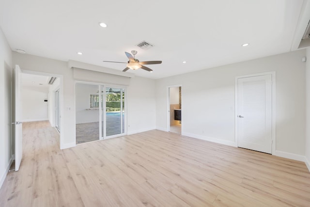 unfurnished room featuring ceiling fan and light wood-type flooring