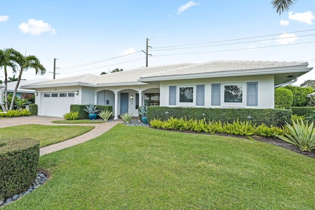 single story home with a front lawn and a garage