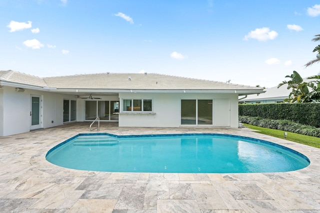 view of pool featuring ceiling fan and a patio