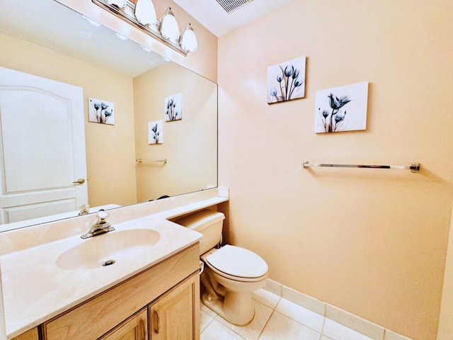 bathroom with tile patterned floors, vanity, and toilet