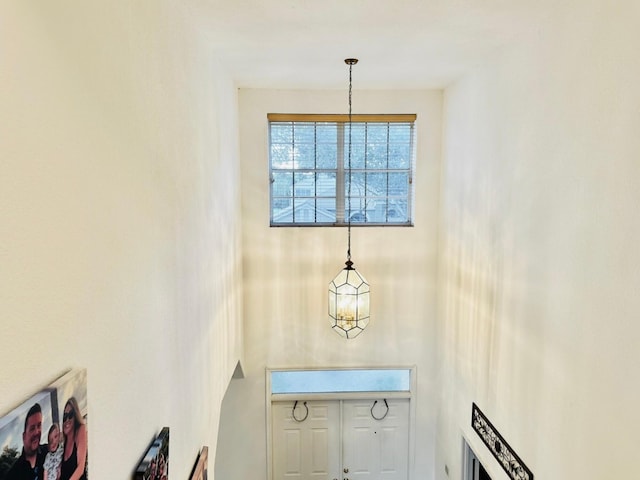 entryway featuring a chandelier