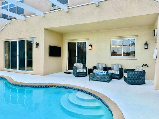 view of pool with a patio and an outdoor hangout area