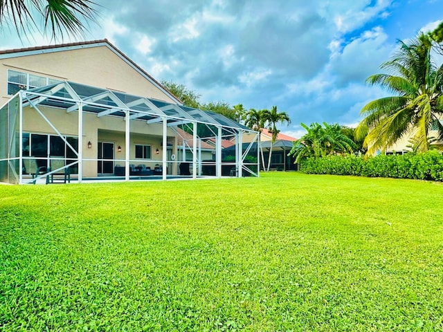 view of yard featuring glass enclosure