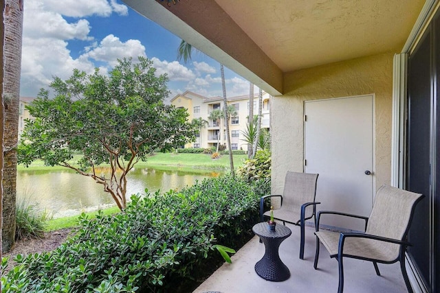 balcony featuring a water view