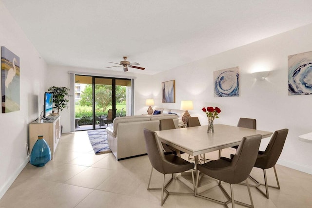 tiled dining area with ceiling fan