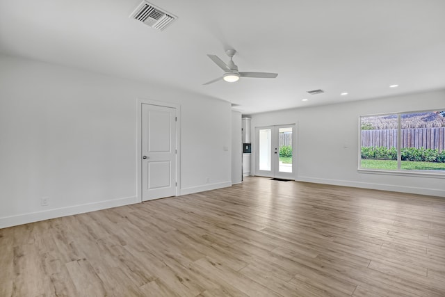 unfurnished room with ceiling fan and light hardwood / wood-style flooring