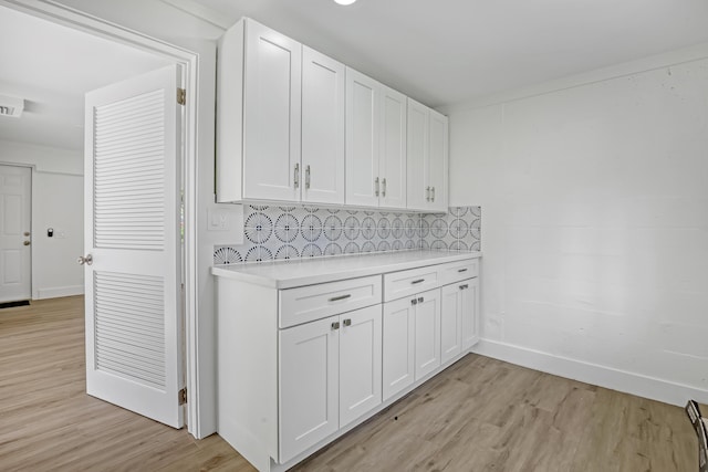 laundry room with light wood-type flooring