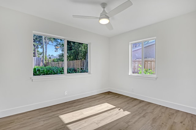 unfurnished room featuring ceiling fan and light hardwood / wood-style flooring