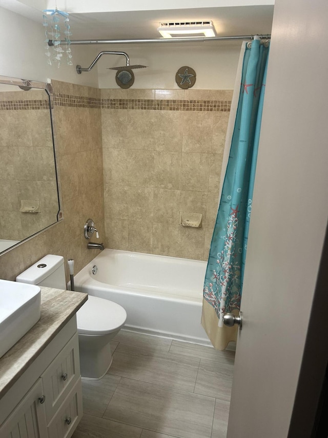 full bathroom with vanity, toilet, and shower / bath combo