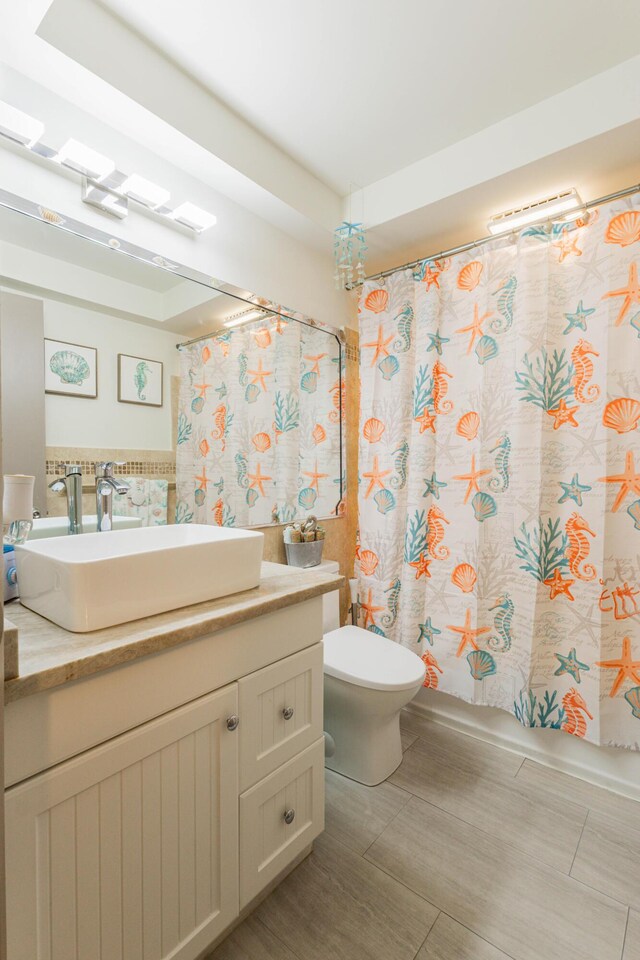 1152 NW 30th Ct Unit 212, Wilton Manors, FL 33311 - bedroom featuring a glass covered fireplace and wood finished floors