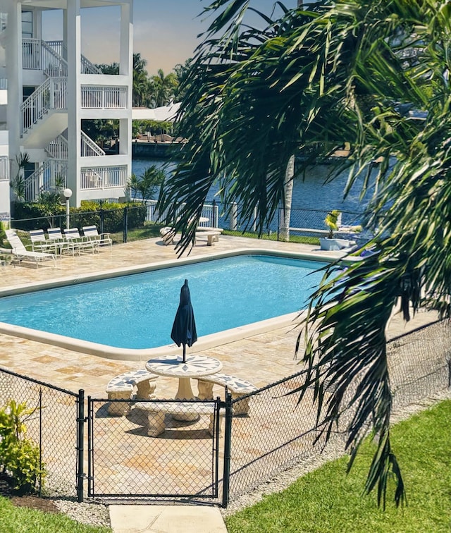 view of swimming pool featuring a patio area