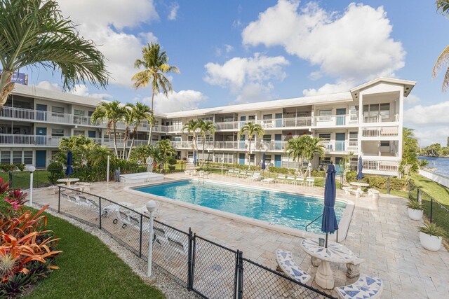 1152 NW 30th Ct Unit 212, Wilton Manors, FL 33311 - pool with fence, a gate, and a patio