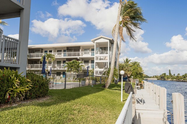 1152 NW 30th Ct Unit 212, Wilton Manors, FL 33311 - bedroom featuring a glass covered fireplace, wood finished floors, and visible vents