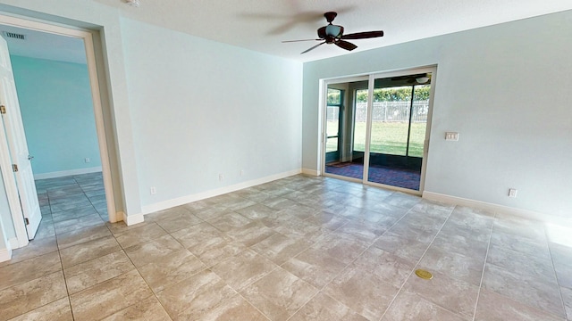 empty room featuring a textured ceiling and ceiling fan