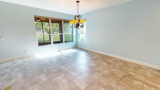 unfurnished dining area featuring an inviting chandelier, plenty of natural light, and light tile patterned flooring