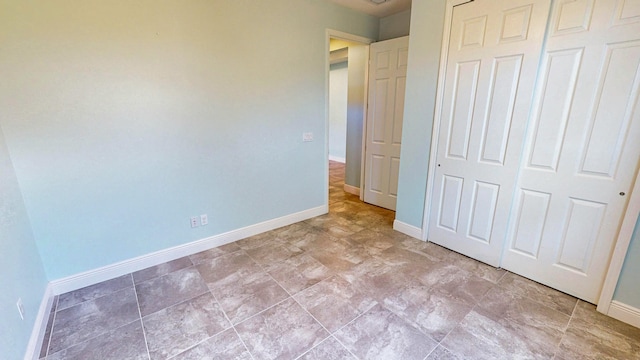 unfurnished bedroom featuring a closet