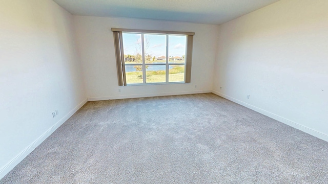 empty room with carpet flooring