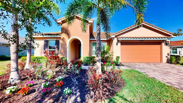 mediterranean / spanish-style home featuring a garage