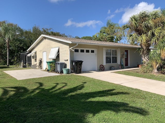 view of front of property featuring a garage and a front lawn